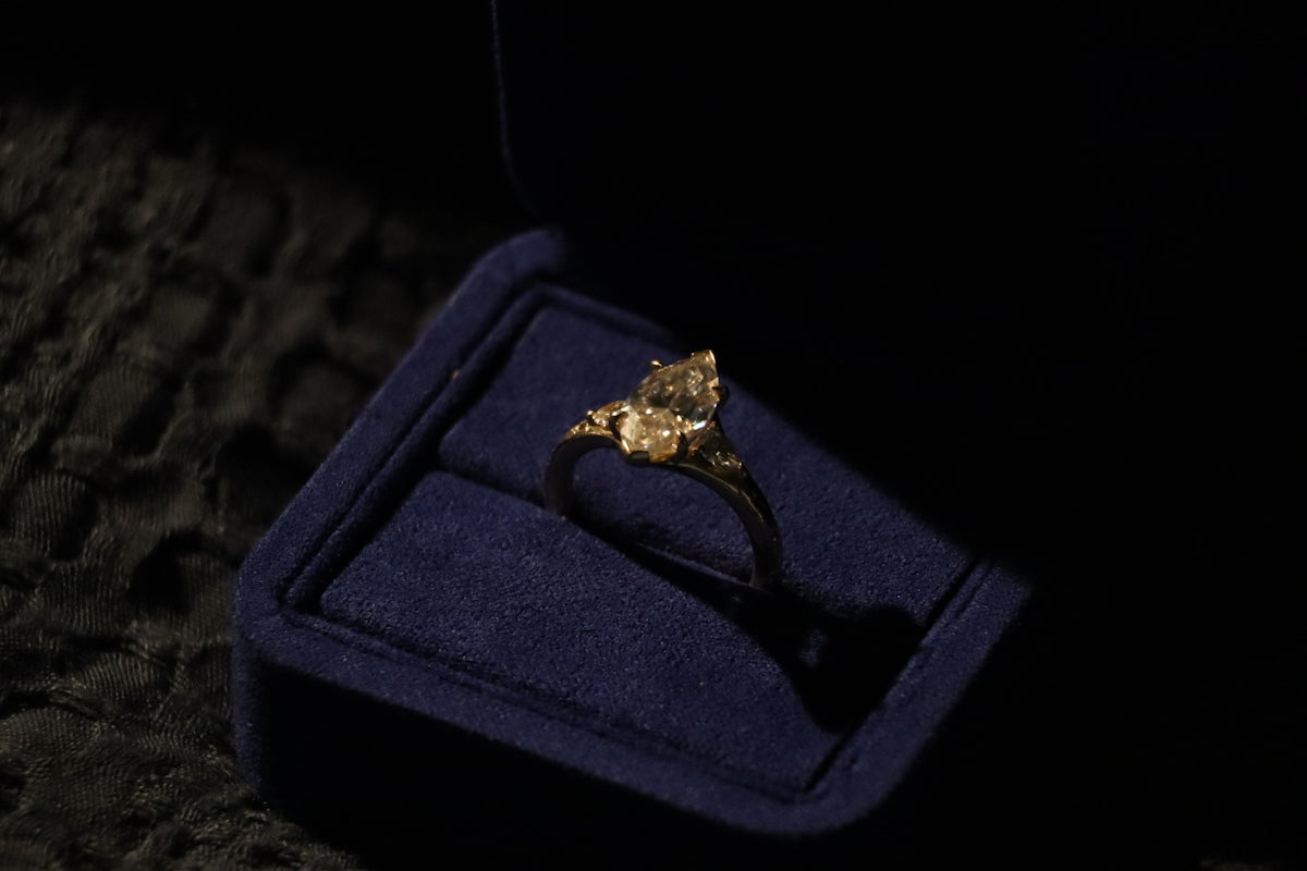 Diamond engagement ring in a blue velvet box