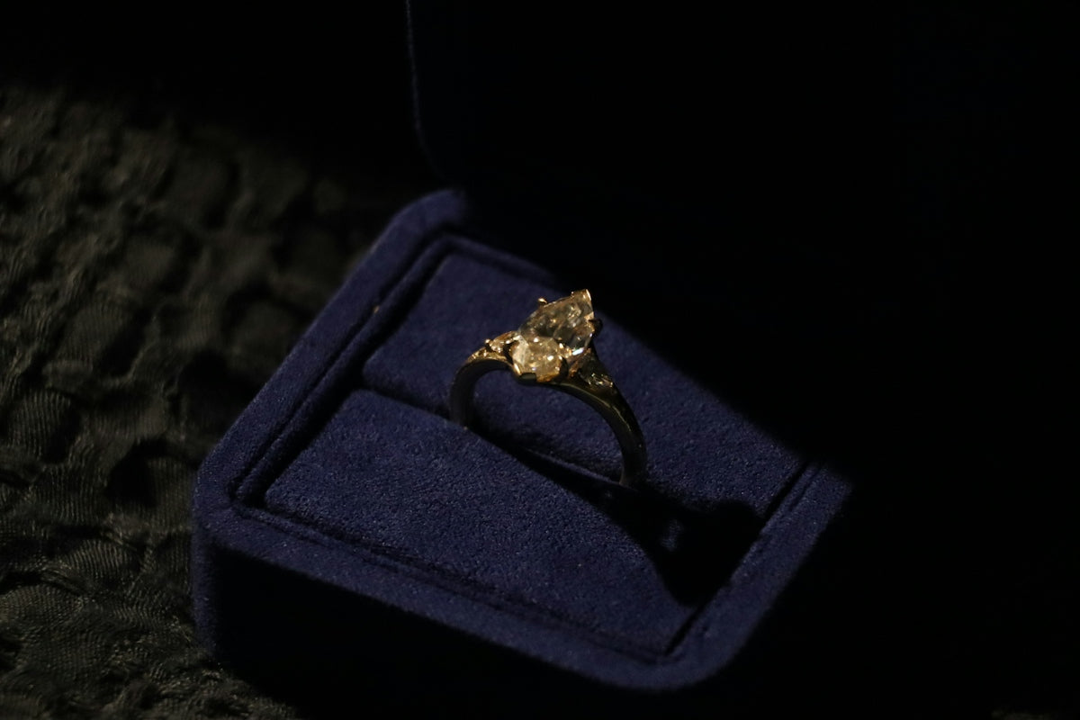 Diamond engagement ring in a blue velvet box